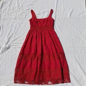 Adorable bright red dress with cutouts in the waist. Perfect for summer!